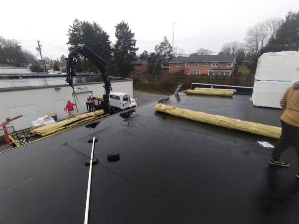 Commercial flat roof membrane installation